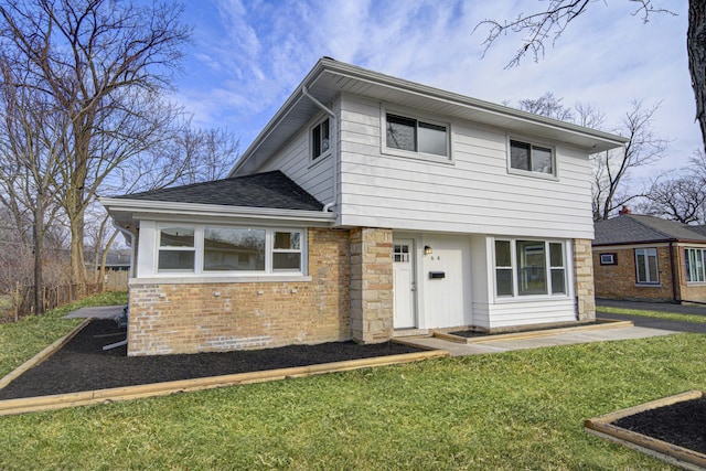 front facade with a front lawn