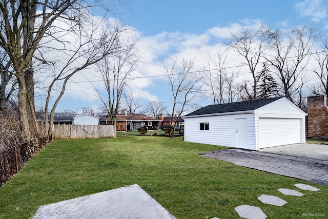 view of yard with an outdoor structure and a garage