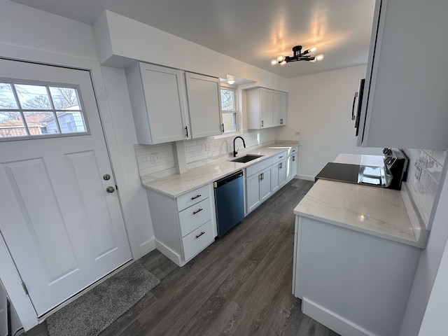 kitchen with decorative backsplash, stove, dark hardwood / wood-style flooring, stainless steel dishwasher, and white cabinetry