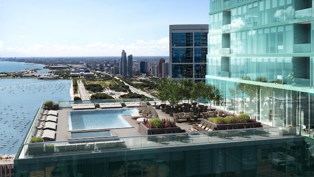 view of pool with a water view