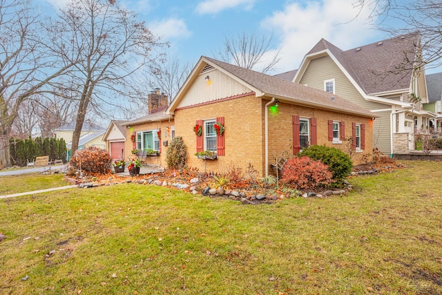 view of side of home with a lawn