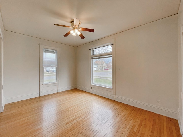 empty room with light wood-type flooring and ceiling fan