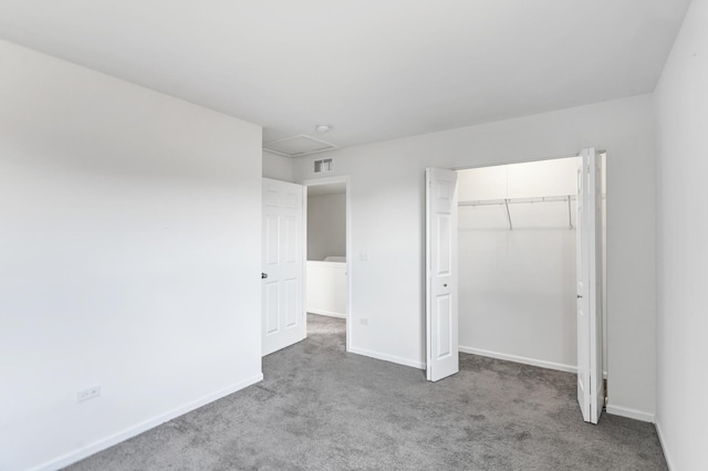 unfurnished bedroom featuring a closet and carpet floors