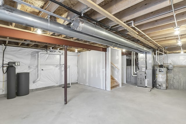 basement with gas water heater and heating unit