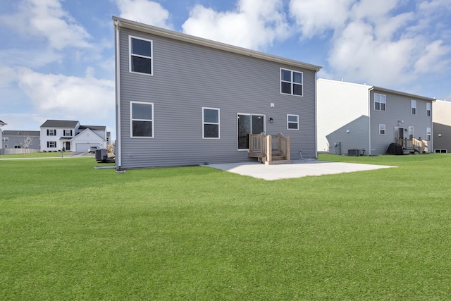 back of property featuring a yard, a patio area, and central AC unit