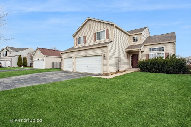 view of front property featuring a garage and a front lawn