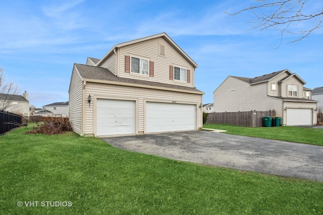 exterior space featuring a garage and a yard