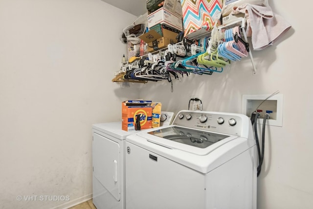 clothes washing area with separate washer and dryer