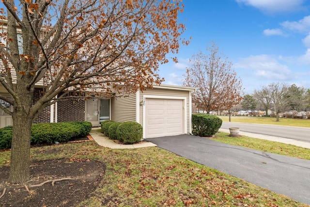 obstructed view of property featuring a garage