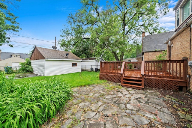 view of yard with a patio area and a deck