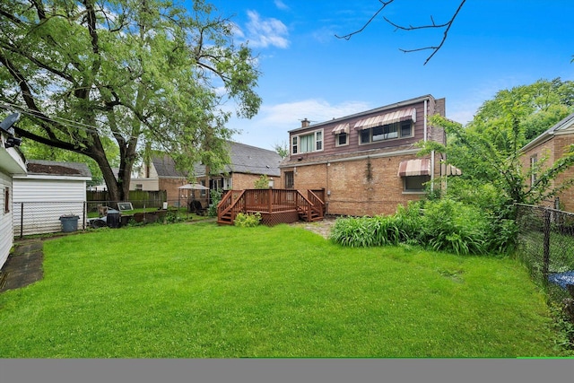 view of yard with a wooden deck