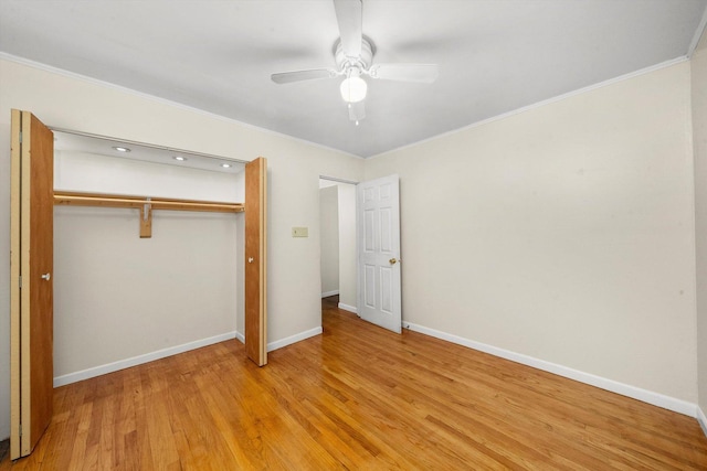 unfurnished bedroom with a closet, light hardwood / wood-style flooring, ceiling fan, and ornamental molding