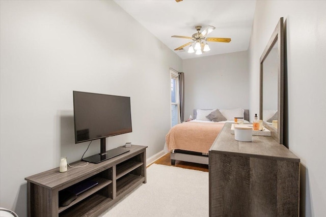 bedroom featuring ceiling fan and light hardwood / wood-style floors