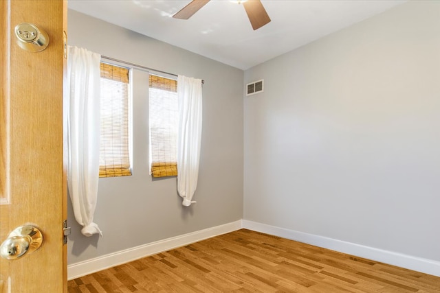 empty room featuring ceiling fan and light wood-type flooring