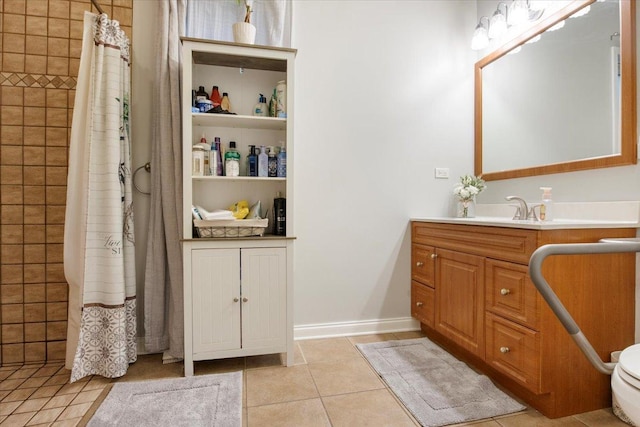 bathroom featuring a shower with shower curtain, vanity, tile patterned floors, and toilet