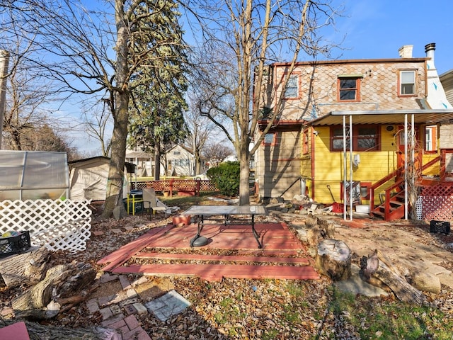 view of yard with a wooden deck