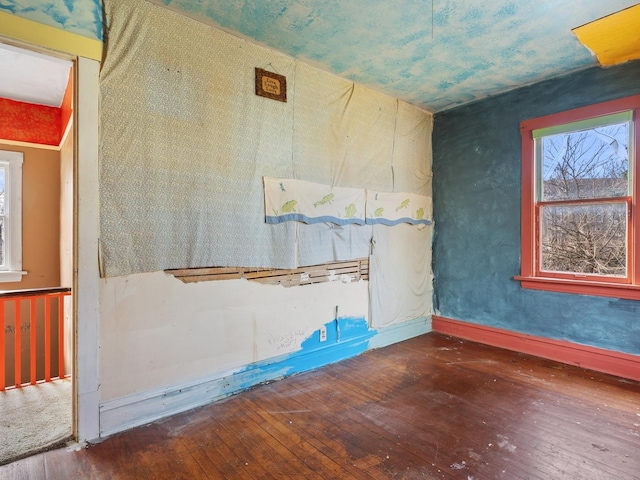 empty room with dark wood-type flooring