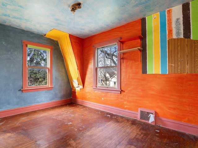 spare room featuring hardwood / wood-style floors