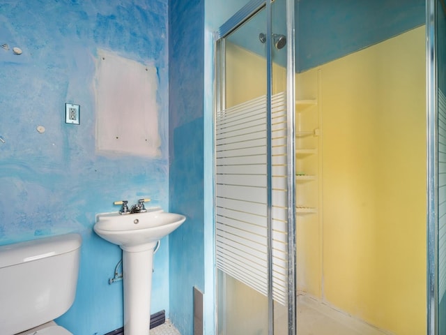 bathroom with toilet and walk in shower