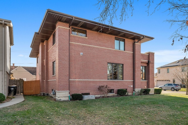 view of side of property with a lawn