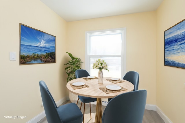 dining room with light hardwood / wood-style flooring