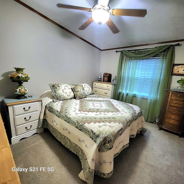 bedroom featuring ceiling fan, crown molding, carpet floors, and a textured ceiling