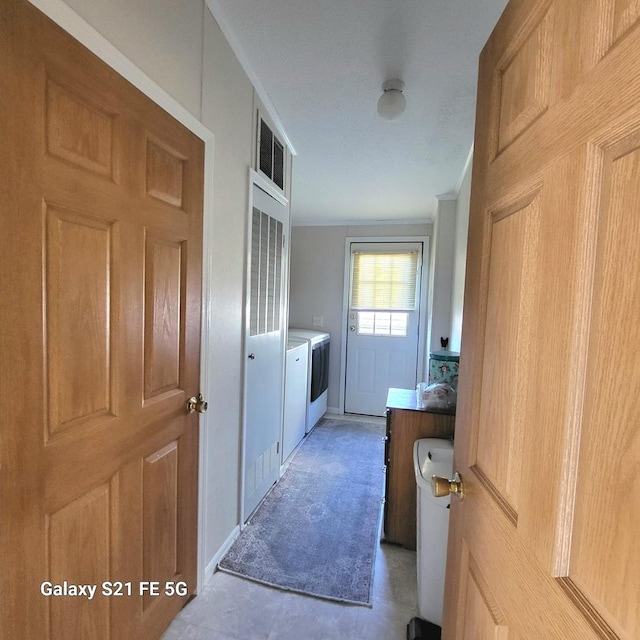 laundry room featuring washing machine and clothes dryer