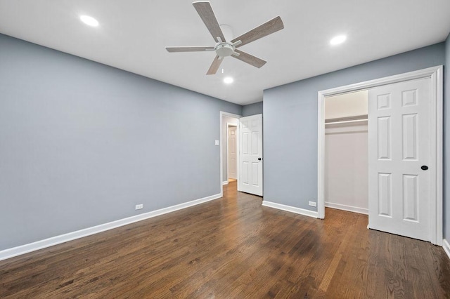 unfurnished bedroom featuring a closet, ceiling fan, and dark hardwood / wood-style flooring