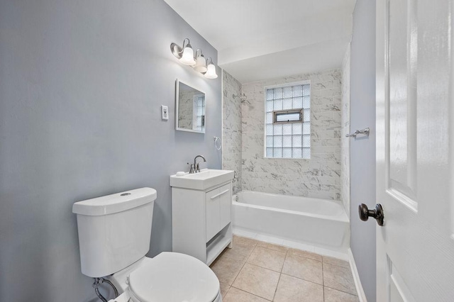 full bathroom with tile patterned floors, tiled shower / bath, vanity, and toilet