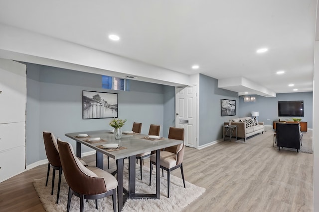 dining space featuring light hardwood / wood-style floors