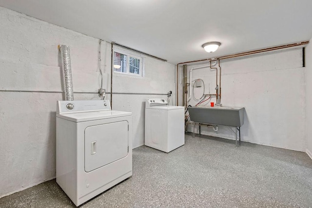 laundry room with washer and dryer and sink