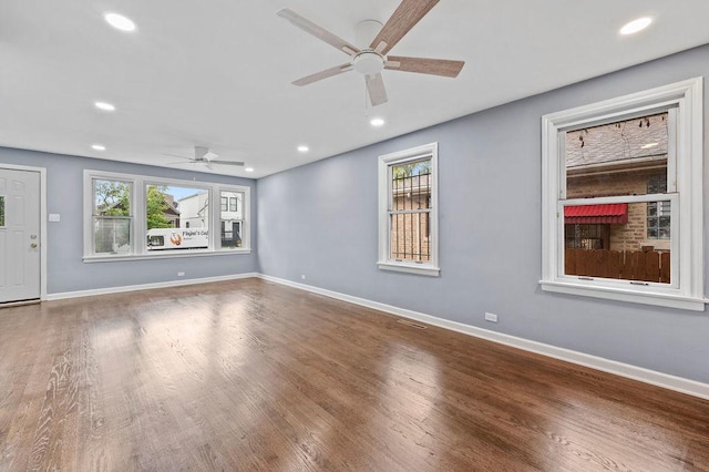 spare room featuring hardwood / wood-style flooring and ceiling fan