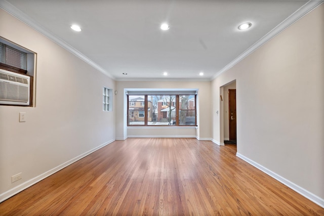 spare room featuring crown molding, light wood-style floors, recessed lighting, and baseboards