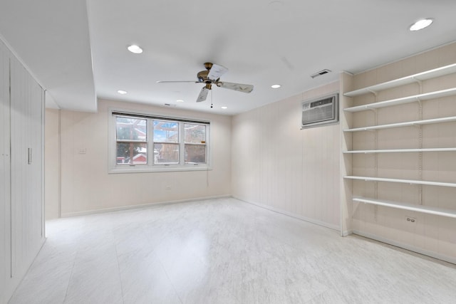 unfurnished room with recessed lighting, visible vents, ceiling fan, a wall mounted air conditioner, and baseboards