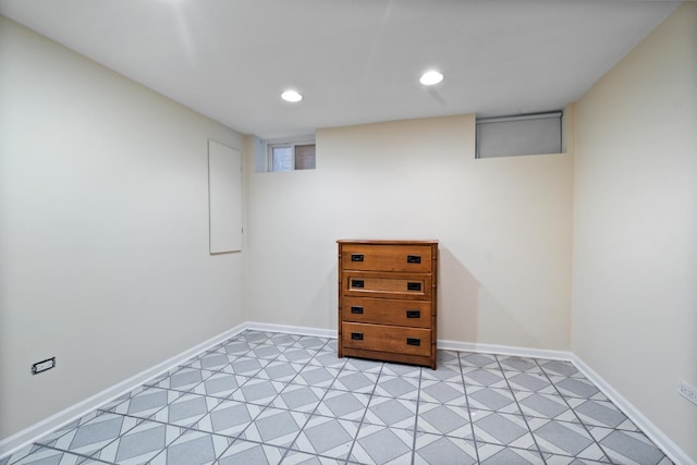 basement featuring recessed lighting and baseboards