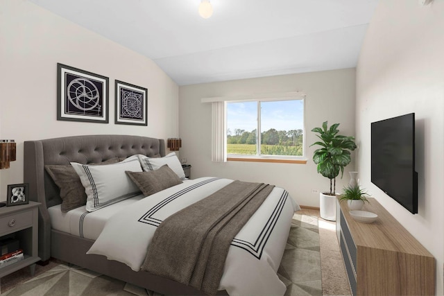 bedroom with light carpet and vaulted ceiling