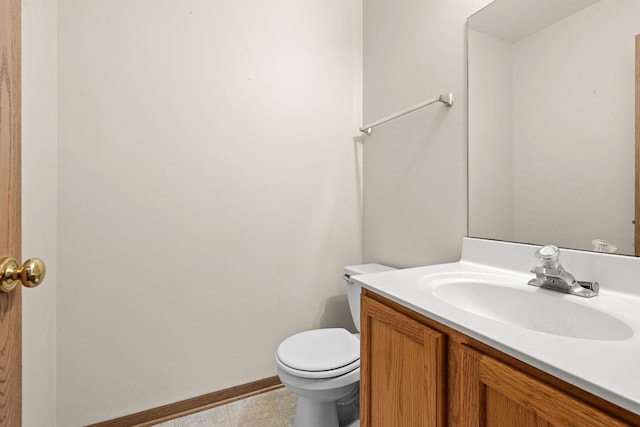 bathroom featuring tile patterned floors, vanity, and toilet