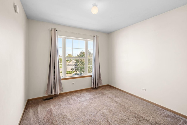 spare room featuring carpet flooring