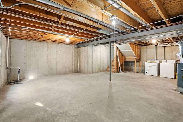 basement featuring washing machine and clothes dryer