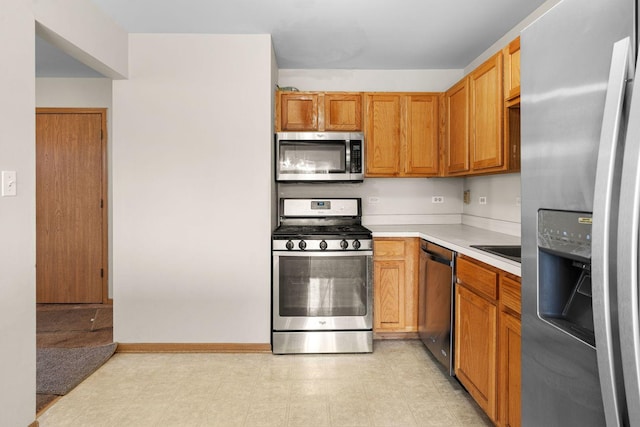 kitchen featuring stainless steel appliances and sink