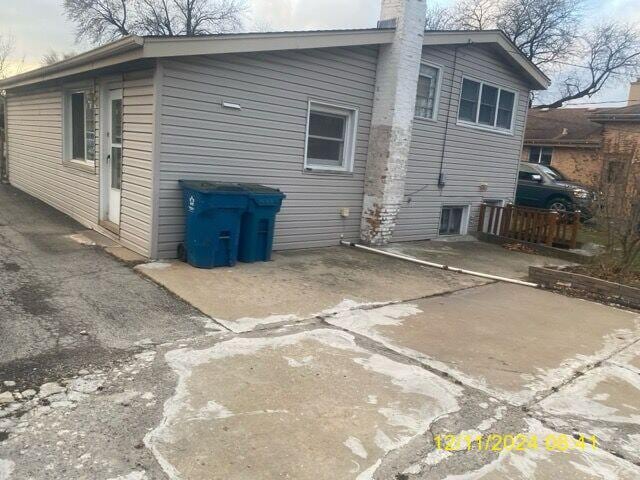 rear view of house with a patio