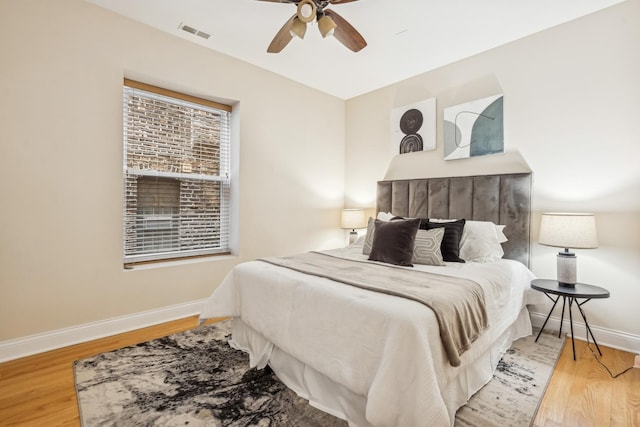 bedroom featuring hardwood / wood-style floors and ceiling fan