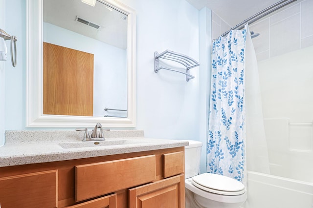 full bathroom featuring shower / tub combo, vanity, and toilet