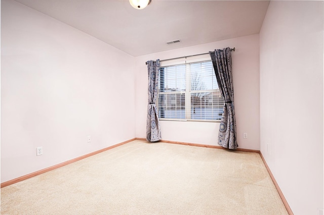 spare room with carpet