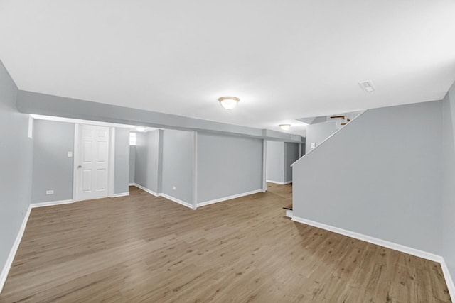 basement featuring light hardwood / wood-style flooring