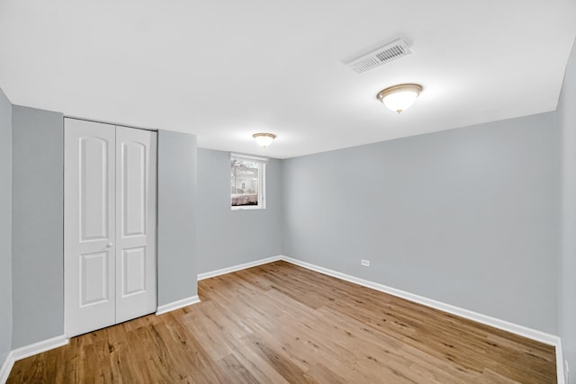 basement featuring light hardwood / wood-style flooring