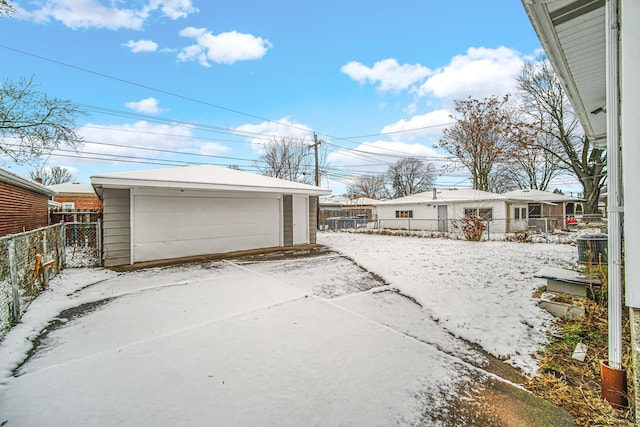 view of snow covered garage