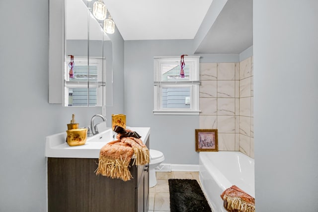 bathroom with tile patterned floors, a bathtub, toilet, and vanity