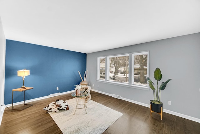 living area with dark hardwood / wood-style floors