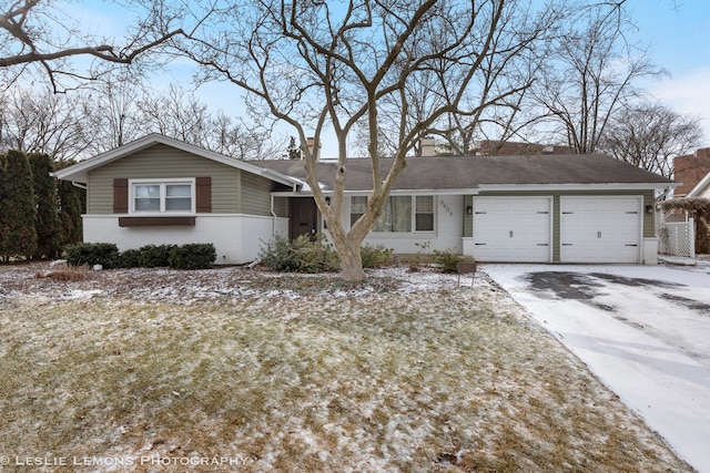 single story home featuring a garage